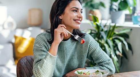 a person eating a salad
