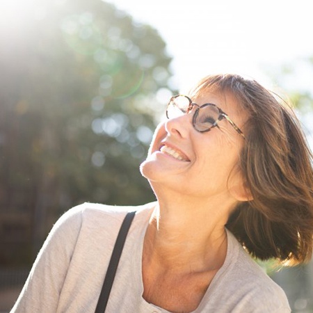 Lady smiles at the sky