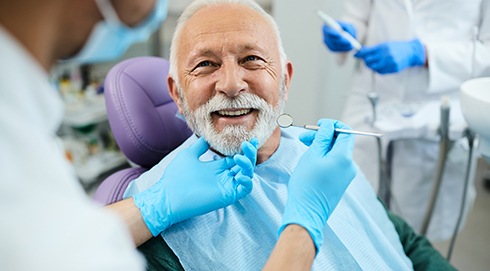 Patient smiling at dentist during checkup