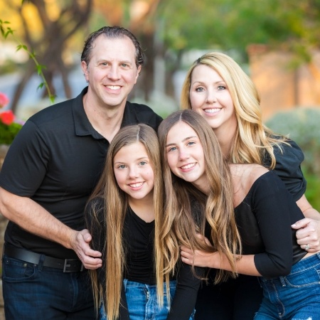 Novi Michigan dentist Doctor Justin Geller with his family outdoors